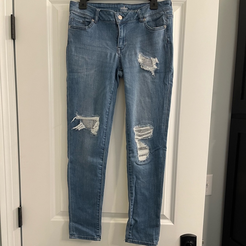 Woman’s curvy skinny mid rise jean with sparkle.